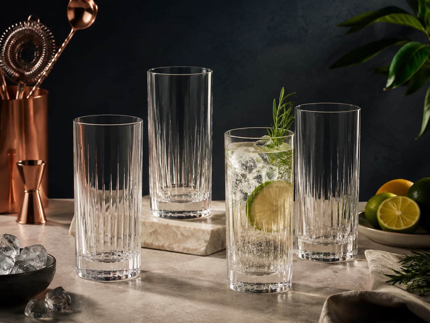 Highball Glass Set of 4 arranged on a dark stone surface