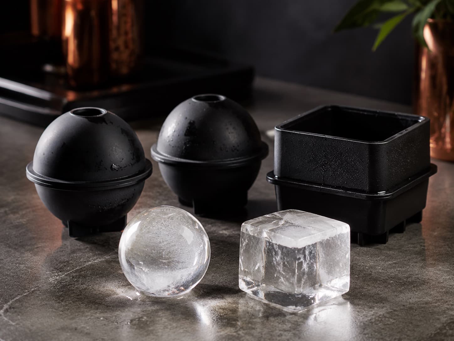 Sphere Ice Mould Set arranged on a dark stone surface
